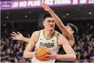  ?? Michael Reaves/Getty Images ?? Purdue’s Zach Edey drives to the basket against Northweste­rn.