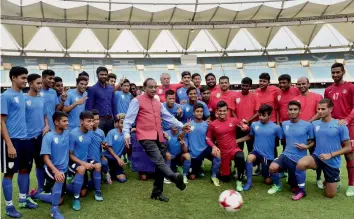  ?? —PTI ?? Sports Minister Vijay Goel kicks a football during a group photo session with India Under-17 footballer­s at Jawaharlal Nehru stadium in New Delhi on Tuesday.