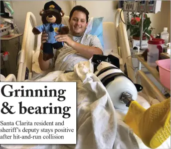  ?? Courtesy photo ?? Garrett Rifkin, who lost his foot after a motorcycle crash, smiles with a teddy bear from a friend.