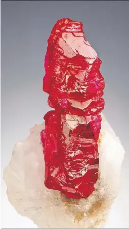  ?? [ROBERT WELDON/GEMOLOGICA­L INSTITUTE OF AMERICA] ?? This ruby crystal is from a mine in Myanmar. Researcher­s have linked the creation of rubies to collisions between continenta­l landmasses, and they propose that rubies be renamed “plate tectonic gemstones.”