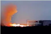  ?? — DC ?? Flame and smoke mark the static test of a rocket engine at the Satish Dhawan Space Centre, Sriharikot­a.