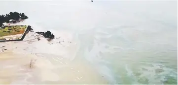  ??  ?? The extent of an oil spill seen at Balikpapan Bay, East Kalimantan, Indonesia in this still image taken from a drone video obtained from social media. — Reuters photo