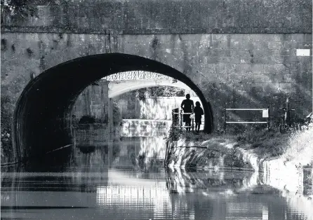  ??  ?? Mike Thornberry took this photo of a couple walking under a bridge along the canal in Bath