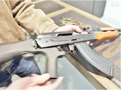  ?? — AFP photo ?? File photo shows a bump stock installed on an AK-47 and its movement demonstrat­ed at Good Guys Gun and Range in Orem, Utah.