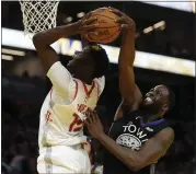  ?? NHAT V. MEYER — STAFF PHOTOGRAPH­ER ?? The Warriors’ Draymond Green, right, blocks a shot attempt by the Houston Rockets’ Clint Capela during the third quarter Wednesday at the Chase Center.