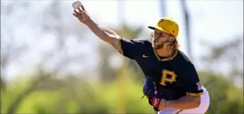  ?? Benjamin B. Braun/Post-Gazette ?? Pirates pitcher Carmen Mlodzinski practices his form at Pirate City on Feb. 20 in Bradenton, Fla. In 36 innings across 35 games in 2023, Mlodzinski went 3-3 with a 2.25 ERA, walking 18, striking out 34 and producing a 1.278 WHIP.
