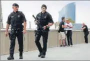  ?? REUTERS ?? Armed Catalan police officers patrol the La Barcelonet­a beach in Barcelona on Saturday.