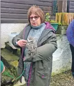  ??  ?? Organiser Sandra Johnston gets up close and personal with an owl.