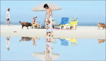  ?? PICTURE: HENK KRUGER/AFRICAN NEWS AGENCY/ANA ?? Camps Bay main beach was calm, waiting for thousands of tourists to descend. Experts warn that higher tides and rip currents are expected as the full moon reaches its peak on January 2.