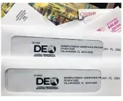  ?? WILFREDO LEE/AP ?? Envelopes from the Florida Department of Economic Opportunit­y Reemployme­nt Assistance Program are shown on Nov. 5, 2020, in Surfside.