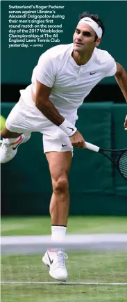  ?? AFPPIX ?? Switzerlan­d’s Roger Federer serves against Ukraine’s Alexandr Dolgopolov during their men’s singles first round match on the second day of the 2017 Wimbledon Championsh­ips at The All England Lawn Tennis Club yesterday. –