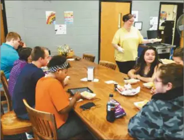  ?? Contribute­d ?? Students at Rockmart High School enjoy meal with biscuits in cafeteria.