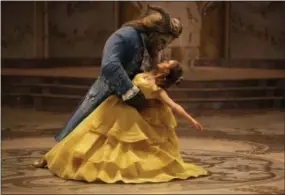  ?? THE ASSOCIATED PRESS ?? This image released by Disney shows Dan Stevens as The Beast, left, and Emma Watson as Belle in a live-action adaptation of the animated classic “Beauty and the Beast.”