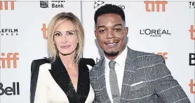  ?? EVAN AGOSTINI THE ASSOCIATED PRESS ?? Julia Roberts and Toronto actor Stephan James attend a premiere for their Amazon series “Homecoming” at TIFF on Friday.