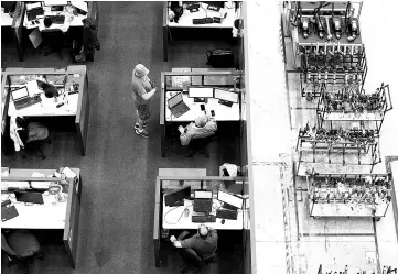  ??  ?? Employees work on computers at Boeing’s final assembly facility in North Charleston, South Carolina.