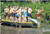  ??  ?? All guys together: a group of women demanded entry the Men’s Pond at Hampstead Heath