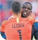  ??  ?? Hugo Loris congratula­tes matchwinne­r, Paul Pogba