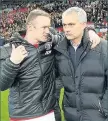  ??  ?? GET SERIOUS No smiles from Rooney or Mourinho