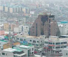  ?? — AFP ?? This general view shows the damaged eight-storey building in the southern city of Jecheon on December 22.