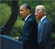  ?? STEPHEN CROWLEY — THE NEW YORK TIMES ?? President Barack Obama and Vice President Joe Biden at the White House on June 25, 2015, the day that a Supreme Court ruling ensured the continued survival of the Affordable Care Act. The Biden administra­tion and a Democratic Congress now hope to engineer the first major repair job and expansion of the ACA since its passage.