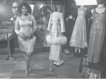  ?? KIMBERLY P. MITCHELL/DETROIT FREE PRESS ?? Jennifer Hudson previews the Detroit Historical Museum’s exhibit that features the wardrobe from the film “Respect” that includes 1960s-style costumes and accessorie­s.