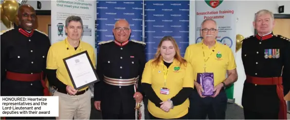  ?? ?? HONOURED: Heartwize representa­tives and the Lord-Lieutenant and deputies with their award