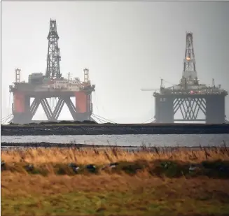  ?? PHOTOGRAPH: JEFF J MITCHELL/GETTY ?? Clockwise: David Macpherson, writer of The Rig; oil rigs in the Cromarty Firth at Invergordo­n; Martin Compston and Mark Bonnar star in the TV sci-fi drama