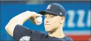  ?? Nathan Denette / Associated Press ?? Aaron Judge throws the ball while working out in Toronto on Wednesday. The Yankees face the Blue Jays Thursday on opening day.