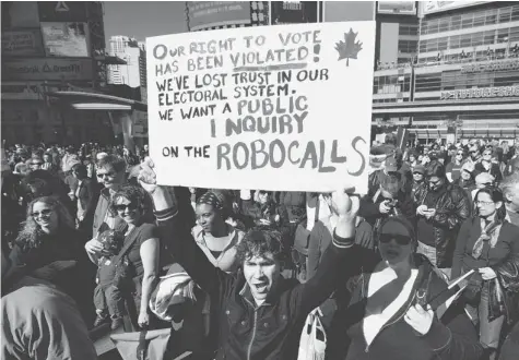  ?? AARON LYNETT/Postmedia News file photo ?? Protesters gather and chant in March 2012, at Toronto’s Yonge Dundas Square in response to the robocalls scandal. Elections Canada ended up
reviewing reports that more than 31,000 Canadians received the calls and a Federal Court judge found that mass...