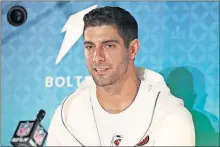  ?? [AP PHOTO/STEVE LUCIANO] ?? San Francisco 49ers quarterbac­k Jimmy Garoppolo speaks to the media during Opening Night for the NFL Super Bowl 54 football game, Monday in Miami.