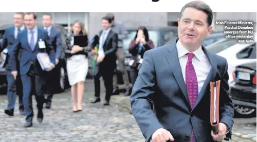  ?? PAUL FAITH ?? Irish Finance Minister, Paschal Donohoe emerges from his office yesterday