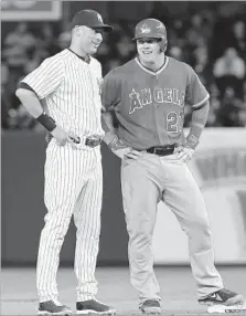  ?? John Minchillo Associated Press ?? DESPITE ALL his great career, Derek Jeter, left, was never considered baseball’s best player, as Mike Trout, right, has been.