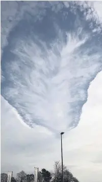  ??  ?? Amateur photograph­er Carlos Hyland has been capturing pictures of clouds across Macclesfie­ld. This one is a fallstreak hole.