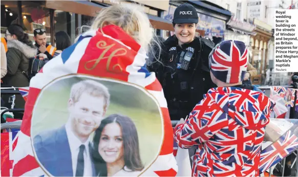  ?? Reuters ?? Royal wedding fever is building on the streets of Windsor and beyond, as Britain prepares for Prince Harry and Meghan Markle’s nuptials