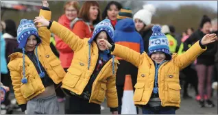  ??  ?? Triplet brothers Conor, Tommy and John Moynihan (aged five) from Tralee getting active at the ‘Operation Transforma­tion’ walk at the Trale Bay Wetlands on Saturday morning.