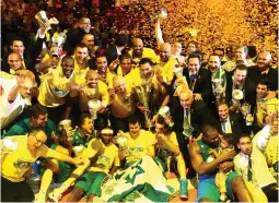  ?? (Giuseppe Cottini/Reuters) ?? MACCABI ELECTRA Tel Aviv players celebrate after winning the Euroleague Final Four final basketball game against Real Madrid, in 2014.