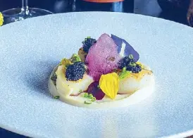  ??  ?? Pan Fried Scallop Topped with Black Caviar with green asparagus, beetroot foam and Brittany sauce