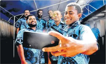  ?? Picture: FILE/JONA KONATACI ?? Salesi Veiseavalu takes a selfie with his mates in Suva.