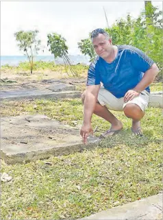  ?? Picture: REINAL CHAND ?? Headman Ratu Sione Ravusou shows the damage done to their graveyard because of rising sea level at Naqiroso settlement in Lautoka.