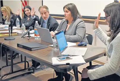  ?? HERALD FILE PHOTO ?? ALL IN FAVOR: Members of the Cannabis Control Commission, from left, Kay Doyle, Shaleen Title, Chairman Steven Hoffman, Jennifer Flanagan and Britte McBride, take a vote at a December public meeting.