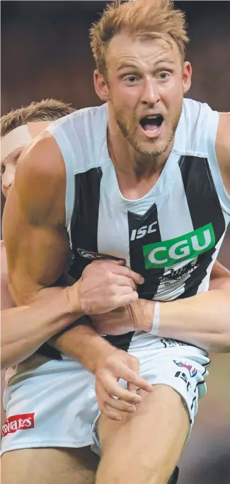  ?? CHANGING ROLE: Collingwoo­d player Ben Reid will make the switch from being a defender to playing forward for the Magpies in the 2018 AFL season. ??