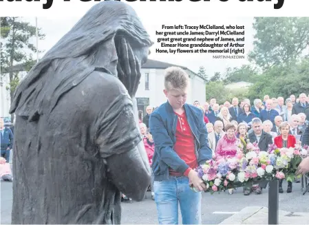  ??  ?? From left: Tracey McClelland, who lost her great uncle James; Darryl McClelland great great grand nephew of James, and
Eimear Hone granddaugh­ter of Arthur Hone, lay flowers at the memorial (right)
MARTIN McKEOWN