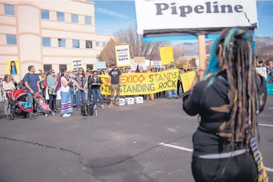  ?? BY KEVIN ROBINSON-AVILA JOURNAL STAFF WRITER ?? New Mexico indigenous leaders, veterans and climate activists protest the Dakota Access Pipeline in January at the Army Corps of Engineers office in Albuquerqu­e. ROBERT E. ROSALES/JOURNAL