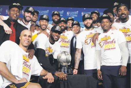  ?? Elise Amendola / Associated Press ?? The Cleveland Cavaliers pose with their trophy after winning Game 5 of the NBA Eastern Conference finals.