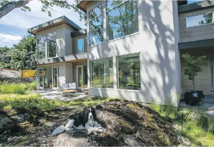  ??  ?? A seating area is accessed via French doors. In restoring the Garry oak meadow, the couple planted hundreds of camas bulbs, swaths of Roemer’s fescue tufted hair grass, ocean blush and other native plant species.