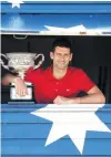  ?? PHOTO: GETTY IMAGES ?? Serbia’s Novak Djokovic shows off the Norman Brookes Challenge Cup yesterday, presented to him for a ninth time as winner of the Australian Open men’s singles title.
