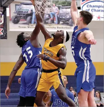  ?? Photo courtesy of Texas Wesleyan ?? John Brown sophomore Densier Carnes, left, and senior Josh Bowling defend Saturday against Texas Wesleyan. The Golden Eagles defeated the No. 11-ranked Rams to complete a two-game road trip in Texas. JBU also won at Southweste­rn Assemblies of God last Thursday.