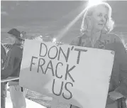  ??  ?? Rio Rancho, N.M., resident Karen Alexander protests the proposed ordinance. In New Mexico, the oil and gas industry employs tens of thousands.