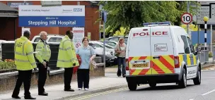  ??  ?? Police outside Stepping Hill hospital during their long investigat­ion into the poisonings carried out by nurse Victorino Chua