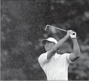  ?? [AP PHOTO] ?? Tiger Woods hits from the first fairway during a practice round for the PGA Championsh­ip on Tuesday at Bellerive Country Club in St. Louis.